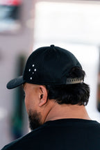 Back of the black Team Teremoana cap showing the Southern Cross stars