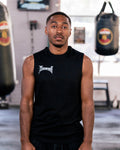 Teremoana wearing the black Team Teremoana Muscle Tank, front view by the punching bags