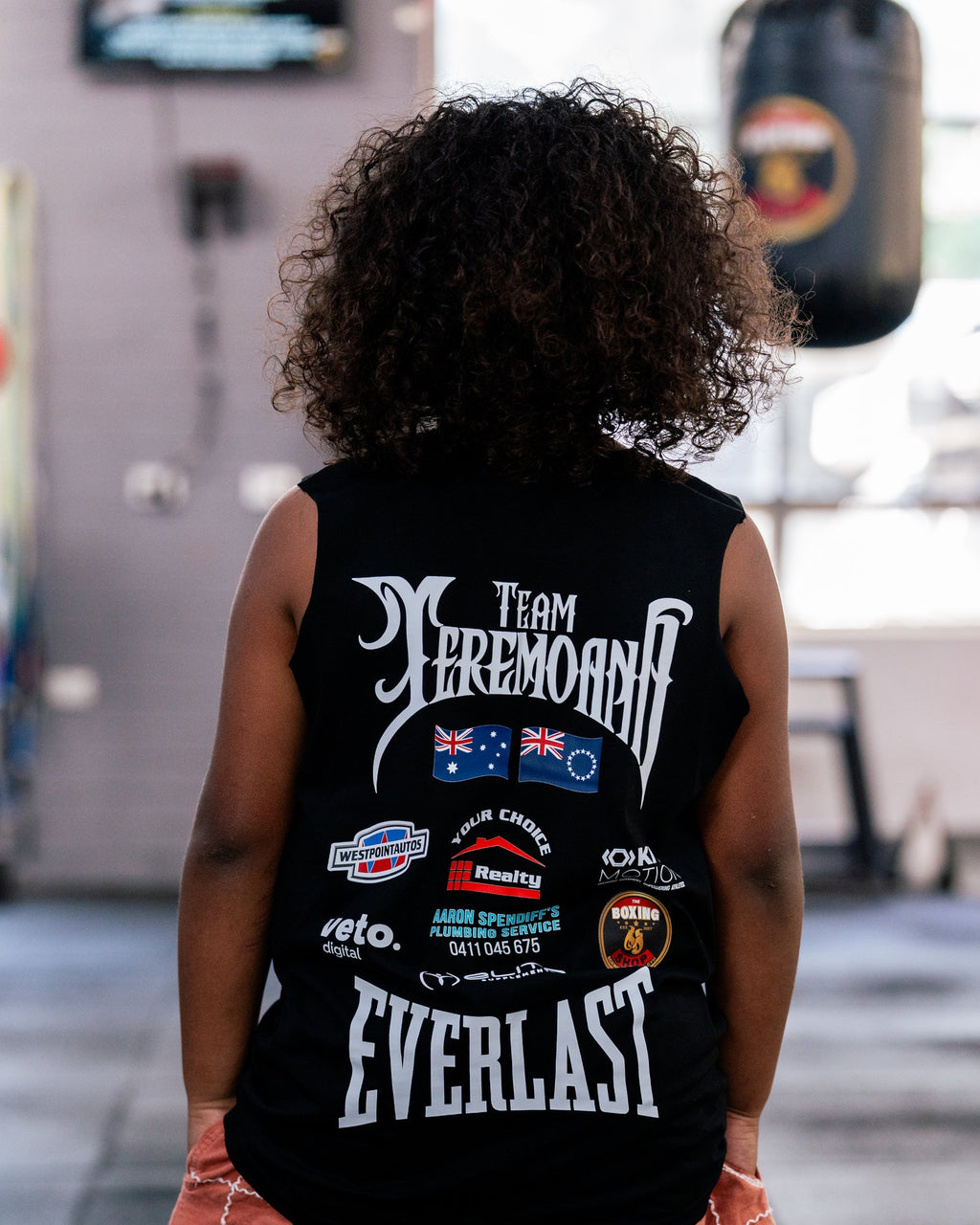 Back of the kids black Team Teremoana Muscle Tank, showing the team back print