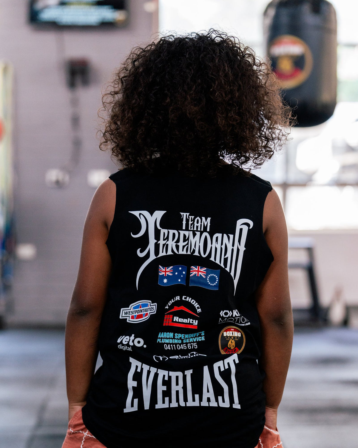 Back of the kids black Team Teremoana Muscle Tank, showing the team back print