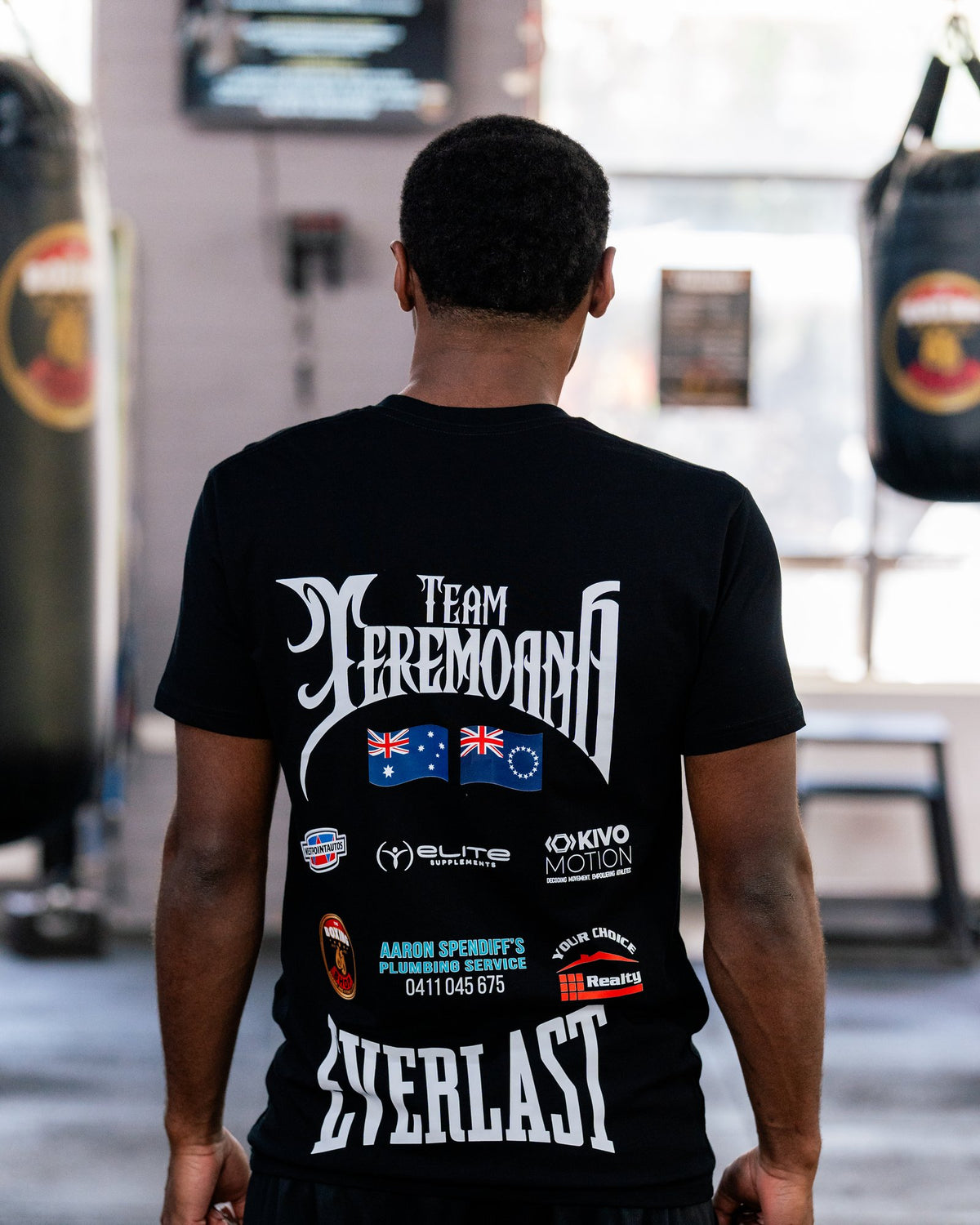 Back of the black Team Teremoana Tee on Teremoana, showing the team back print