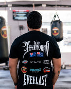 Back view of the black Team Teremoana Tee with the flags and sponsor print