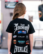 Back view of the kids black Team Teremoana Tee with the flags and sponsor print