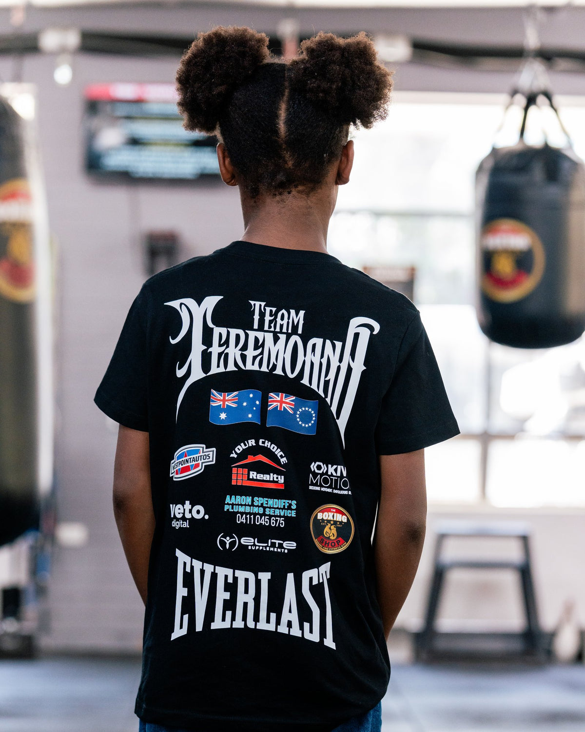 Back of the kids black Team Teremoana Tee, showing the team back print