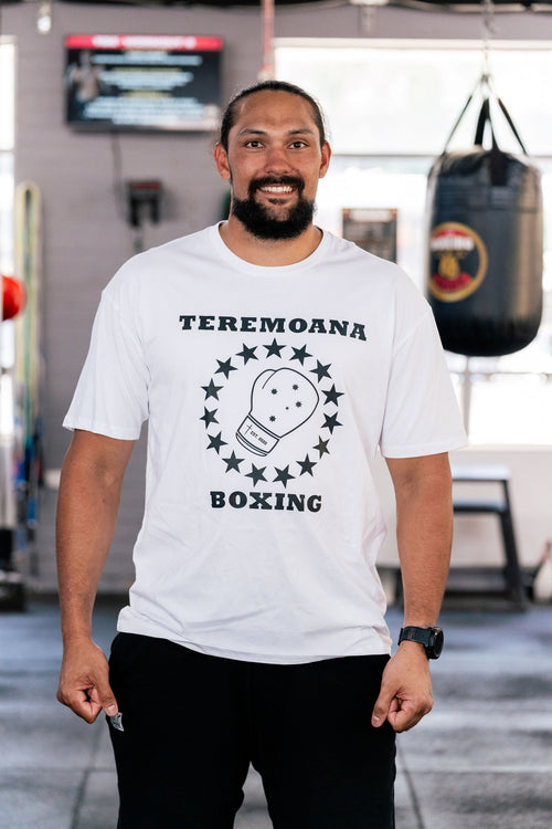 Teremoana wearing the white Teremoana Boxing tee, front view with the star and glove crest