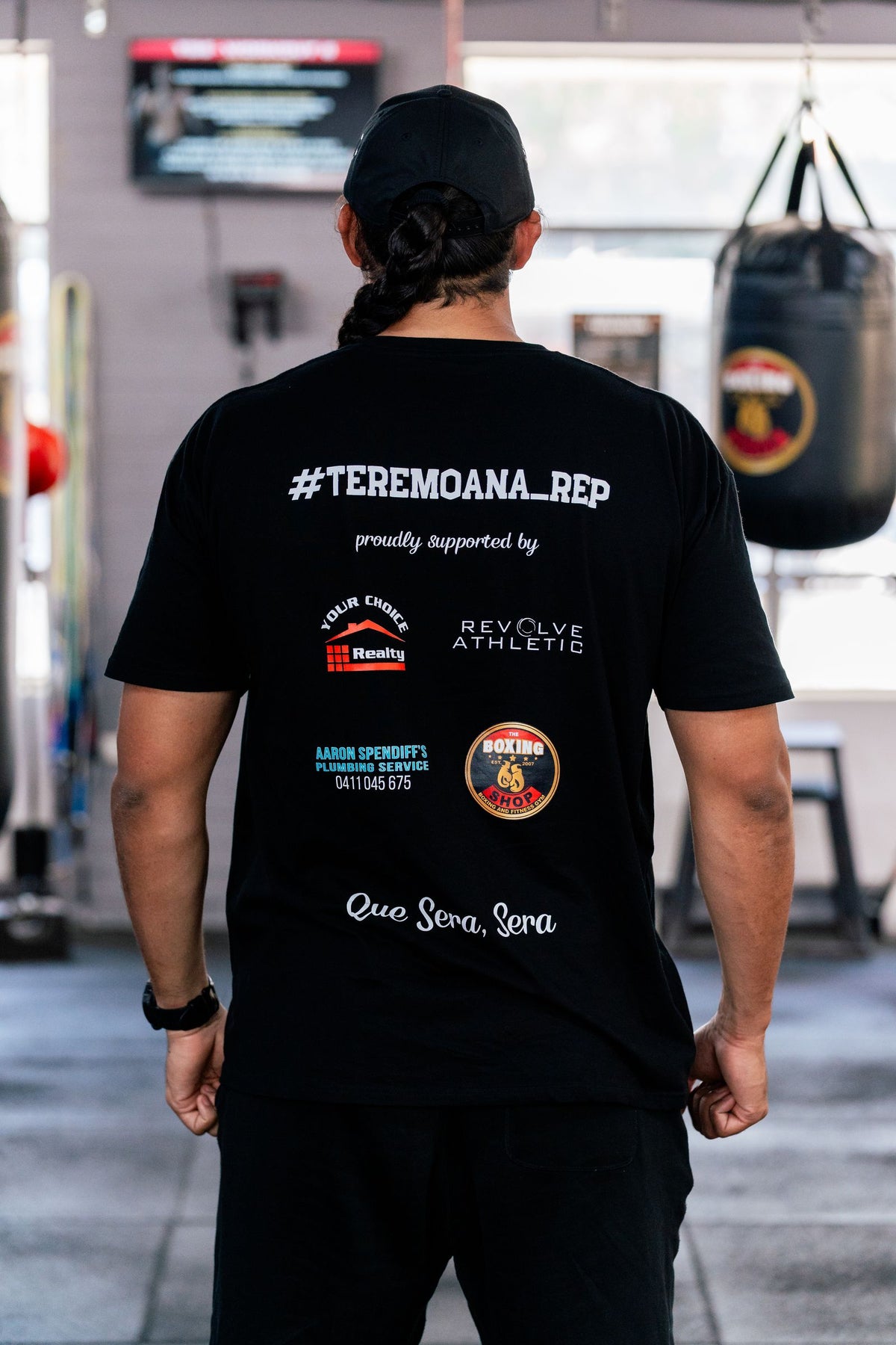 Back of the black Thunder From Down Under tee showing the #TEREMOANA_REP sponsor print